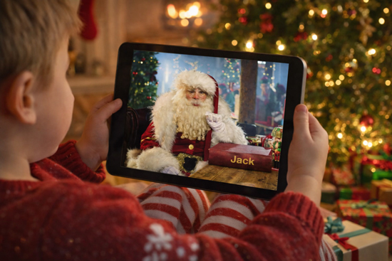 A child watching their personalised Santa video on a tablet
